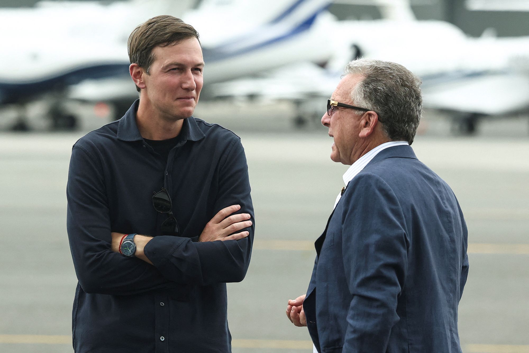 US Special Envoy Steve Witkoff speaks with Jared Kushner at Teterboro Airport, New Jersey, on July 13, 2025.