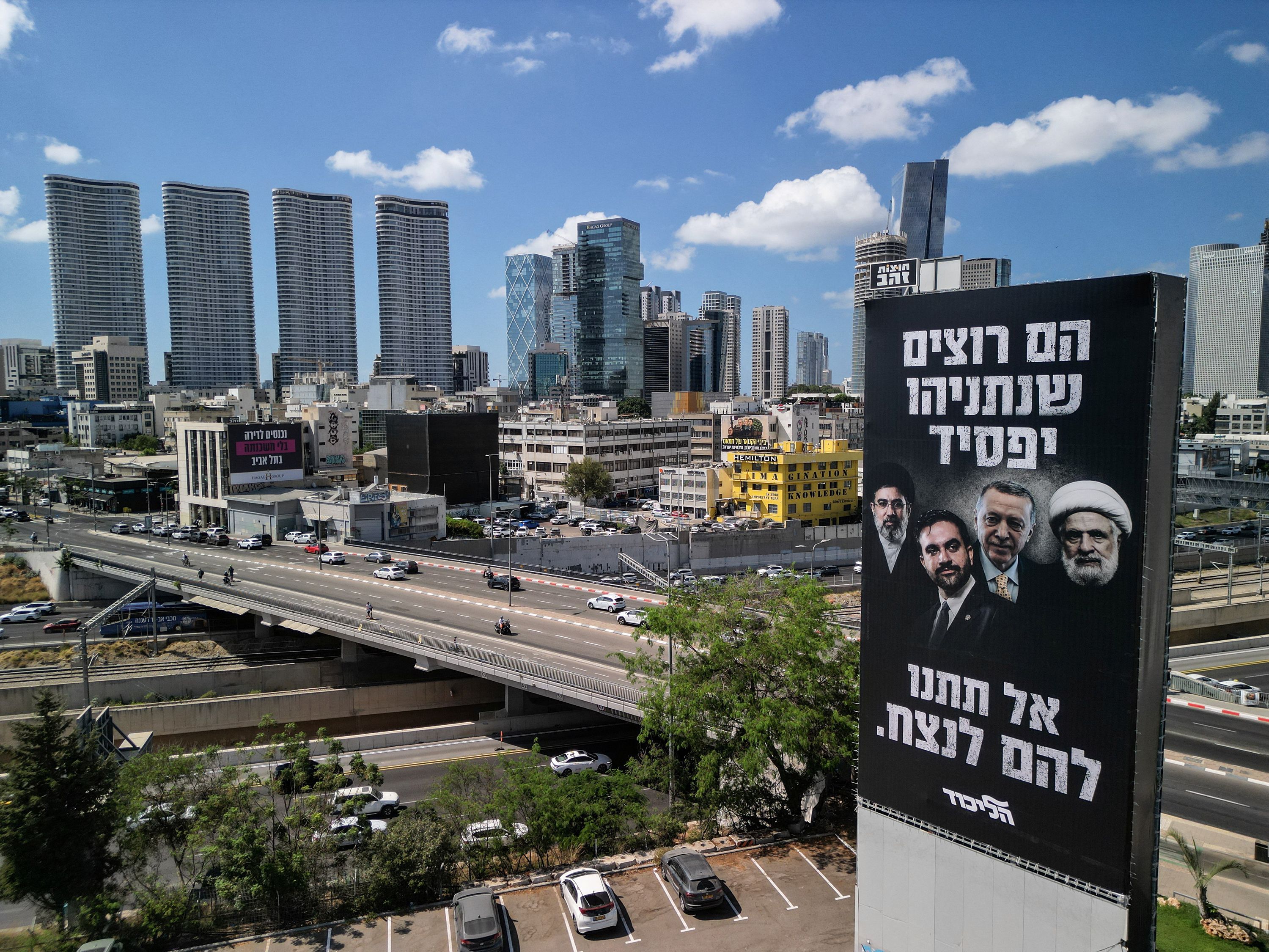 A drone view of an election billboard by Benjamin Netanyahu's Likud Party depicting Iran's Supreme Leader Mojtaba Khamenei, New York City Mayor Zohran Mamdani, Turkish President Tayyip Erdogan and Hezbollah chief Naim Qassem and a text in Hebrew that reads "They Want Netanyahu to Lose, Don't let them Win", in Tel Aviv, Israel August 17, 2026 REUTERS/Amir Cohen