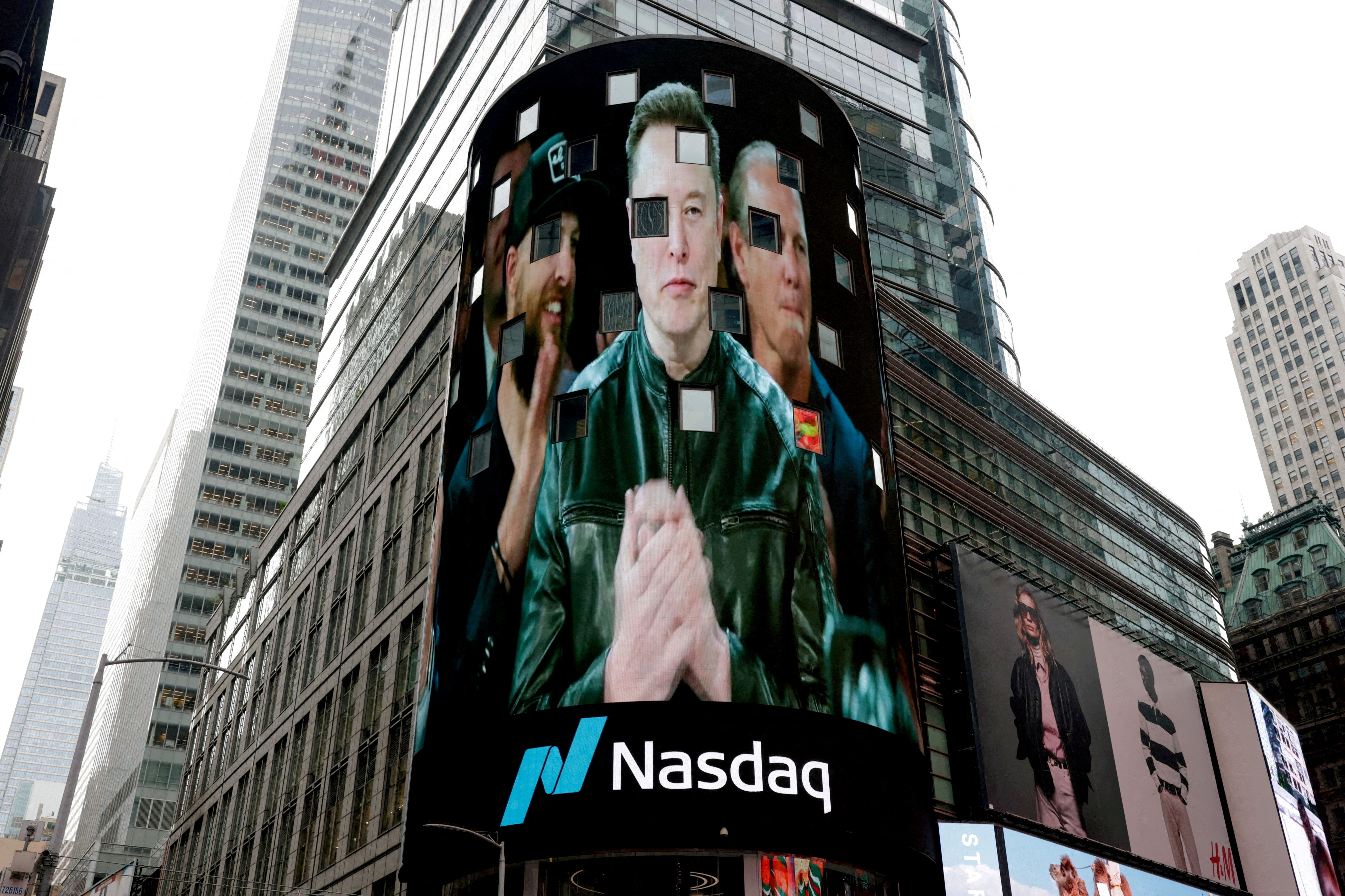 A live feed shows Elon Musk on the day of SpaceX's initial public offering (IPO) at the Nasdaq MarketSite, in New York, on June 12, 2026.