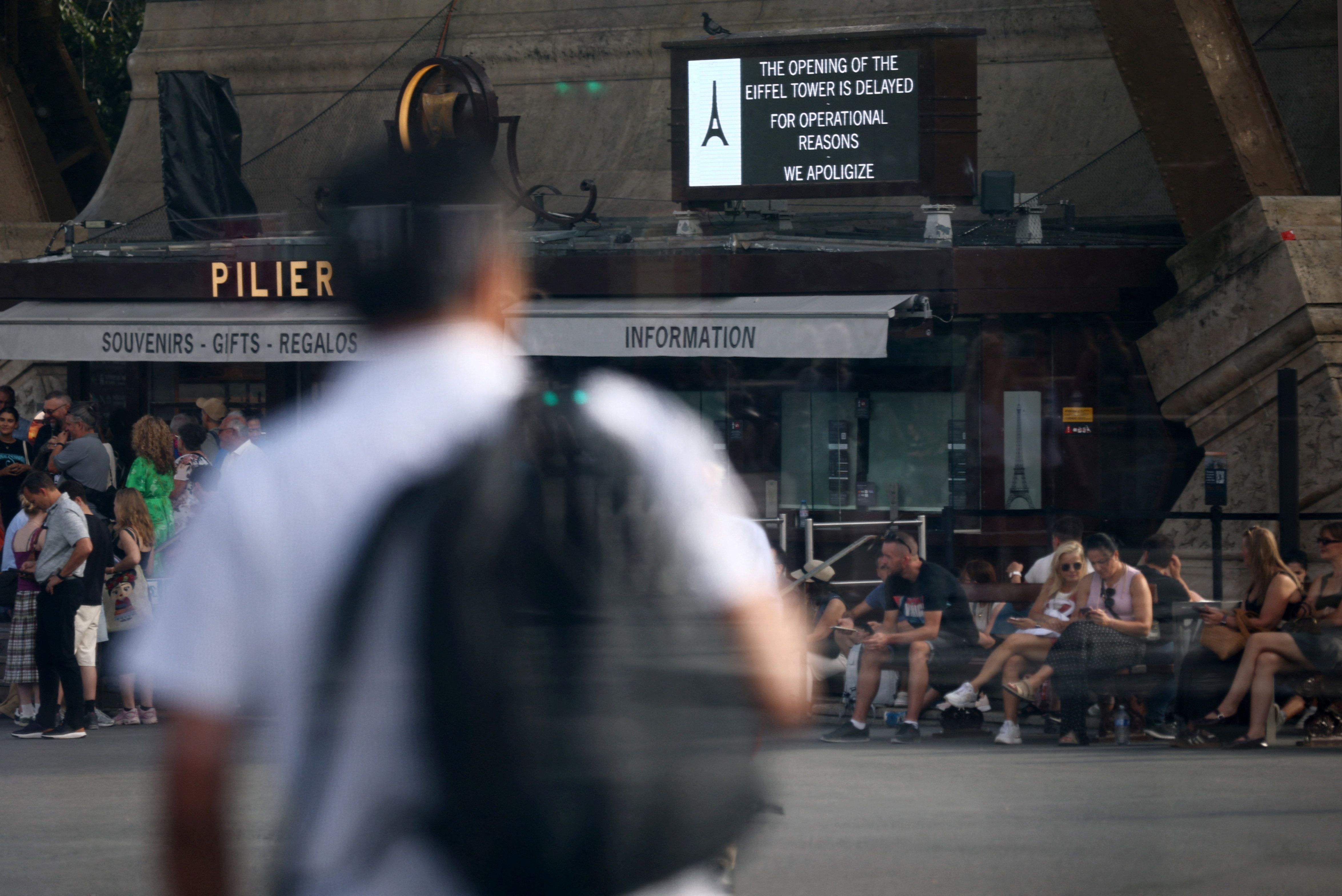 A sign reading "the opening of the Eiffel Tower is delayed for operational reasons, we apologize" is seen at the Eiffel Tower in Paris, France, on September 7, 2026.
