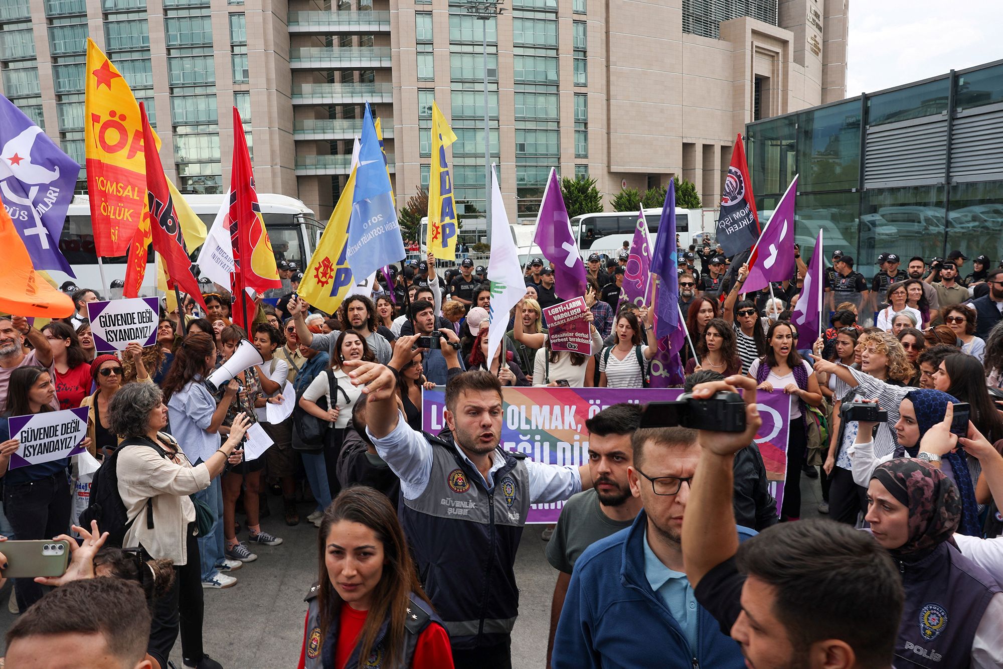 People are surrounded by plainclothes police as they gather outside Caglayan Courthouse, known as the Justice Palace, in solidarity with the LGBTQ+ community and to protest a government campaign that has included sweeping raids on LGBTQ+ associations, in Istanbul, Turkey, September 15, 2026. REUTERS/Dilara Senkaya