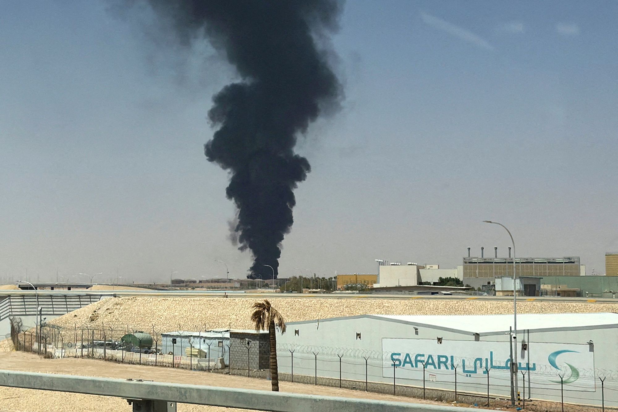 A large plume of black smoke rises from the fuel storage area at King Khalid International Airport, in Riyadh, Saudi Arabia on Saturday.
