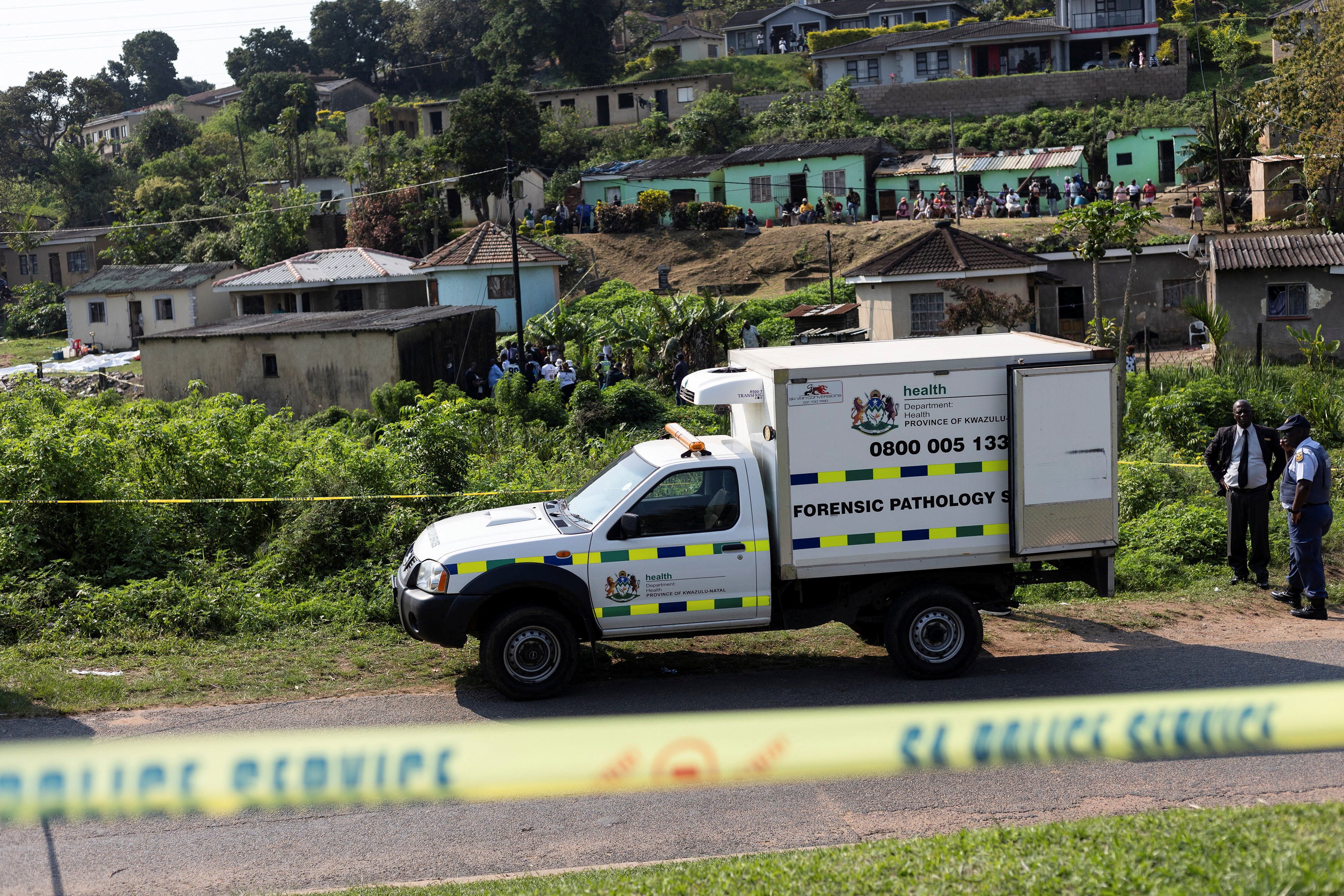 A forensic vehicle is parked near the scene where several people were killed and several others injured, in the township of KwaMakhutha near Durban, South Africa, on September 23, 2026.