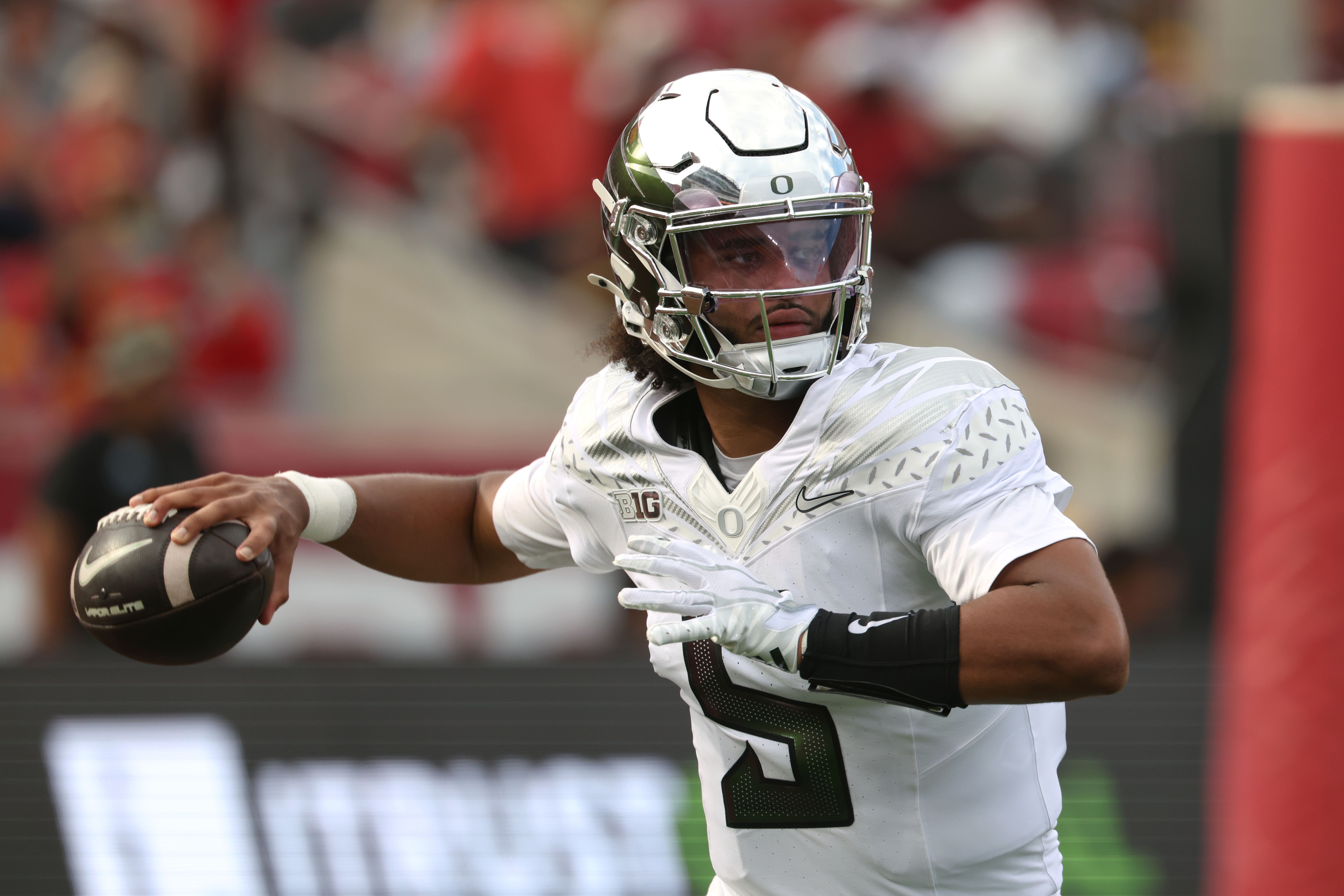 Oregon Ducks quarterback Dante Moore throws a pass against USC Trojans during the first half on Saturday.