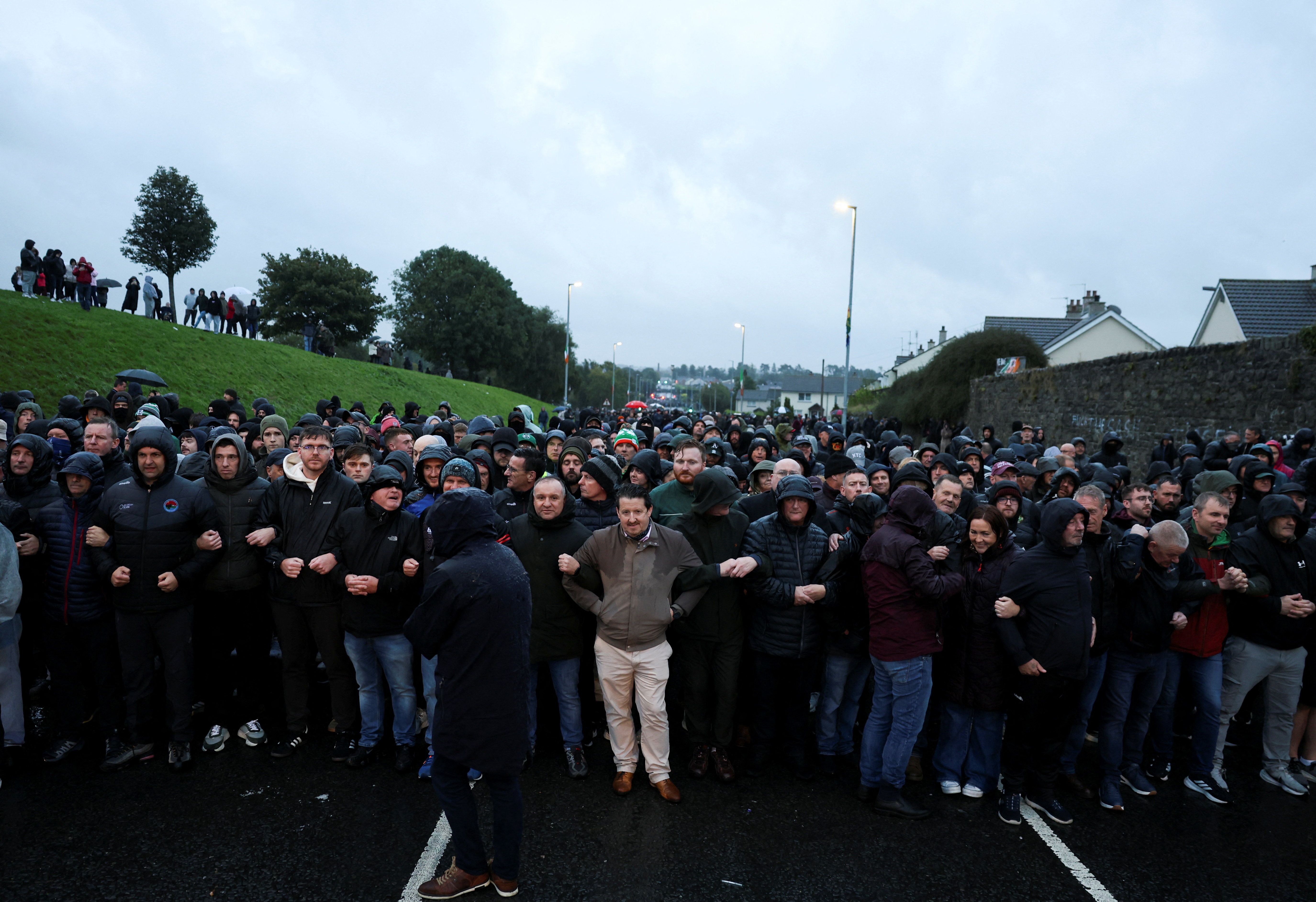 People block the Garvaghy road, a Catholic enclave in the largely Protestant town of Portadown, on the day members of the Protestant Orange Order are expected to march through the area as they take part in the annual Drumcree parade, Northern Ireland, on September 27, 2026.