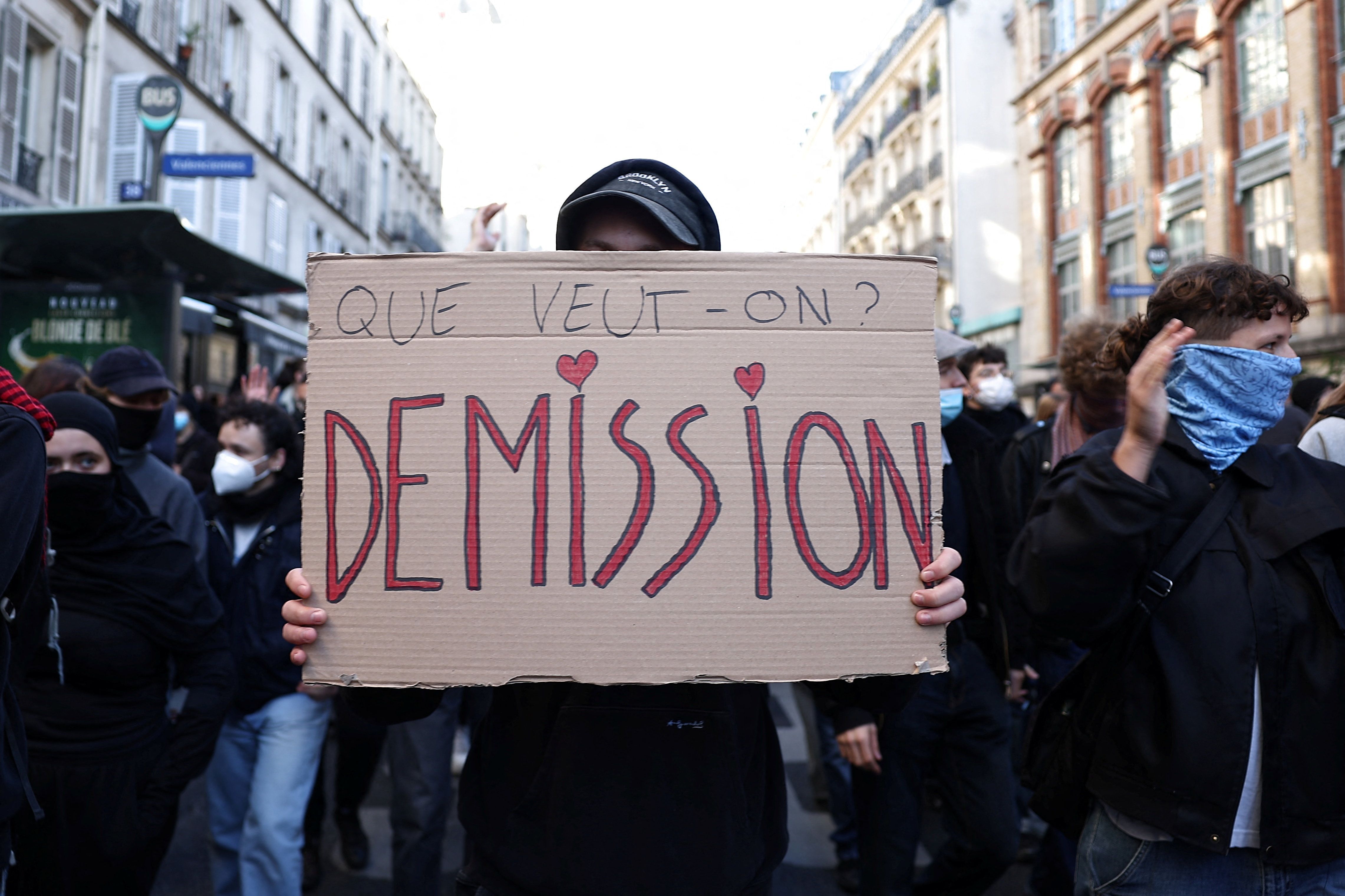 A protester holds a placard reading "What do we want ? Resignation" during a gathering near the Gare du Nord train station in Paris in the morning of demonstrations against the cost of living and rising fuel prices called by the "Yellow Vests" movement, joined by French high school and university students, teachers and parents demanding better school conditions and government action, as well as labour unions, workers, farmers and retirees, France, on October 17, 2026.