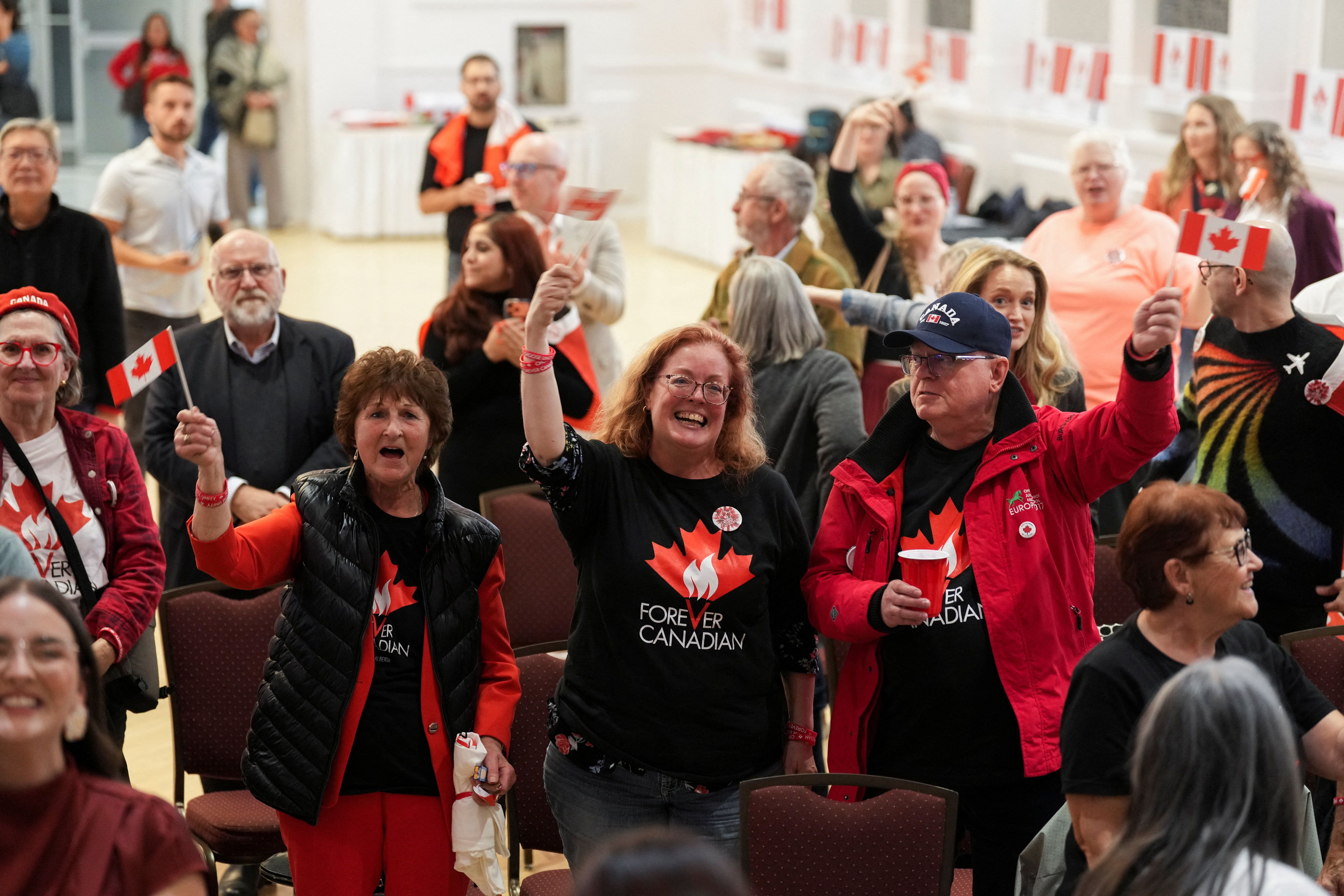 Supporters of the Forever Canadian group, who want Alberta to remain in Canada, react on the day of a non-binding referendum on Alberta sovereignty in Edmonton, Alberta, Canada, on October 19, 2026.