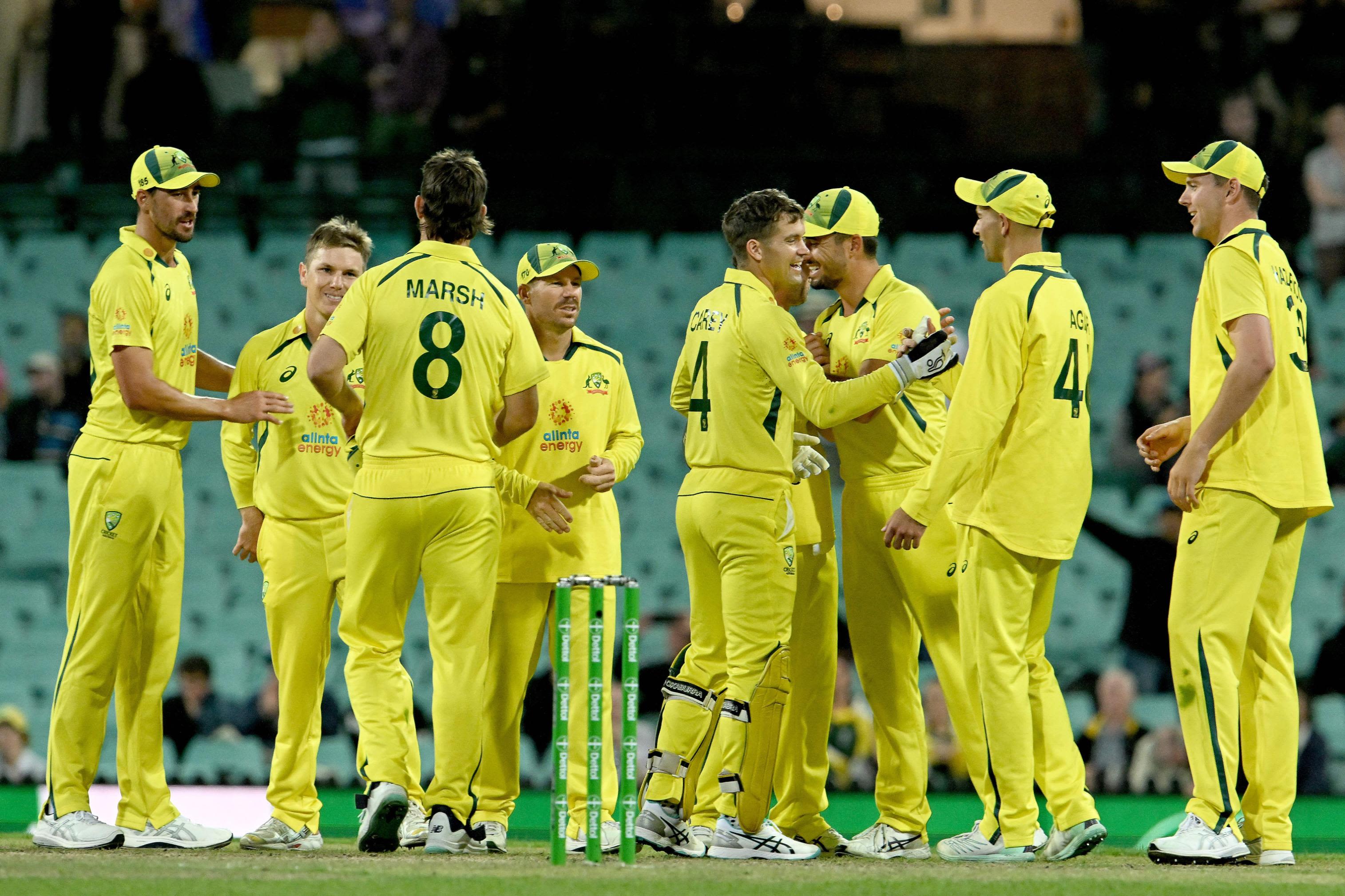 Australia players celebrate their win during the second one-day international (ODI) cricket match between Australia and England at the Sydney Cricket Ground on November 19, 2022. - -- IMAGE RESTRICTED TO EDITORIAL USE - STRICTLY NO COMMERCIAL USE -- (Photo by Saeed KHAN / AFP) / -- IMAGE RESTRICTED TO EDITORIAL USE - STRICTLY NO COMMERCIAL USE -- (Photo by SAEED KHAN/AFP via Getty Images)