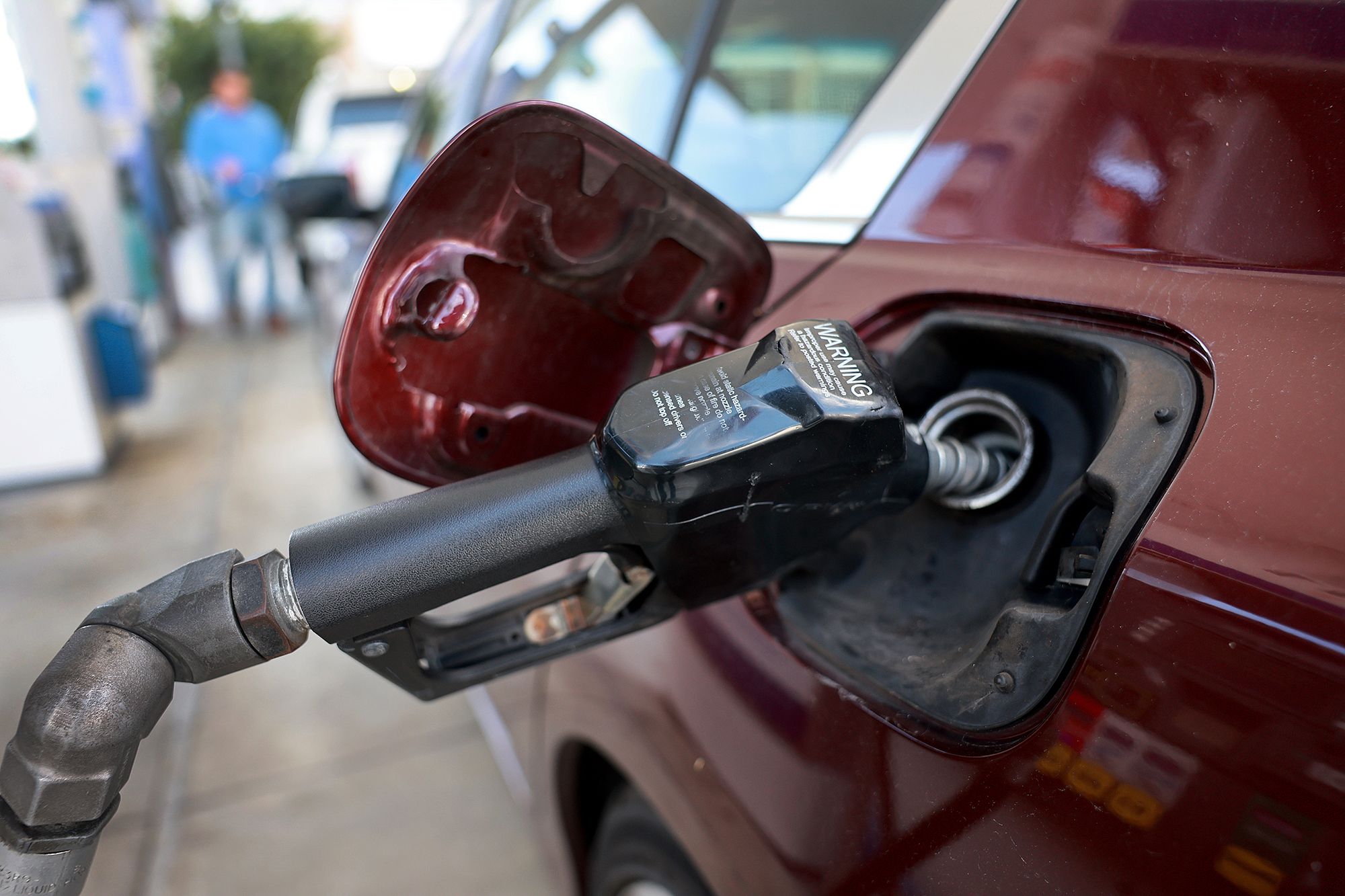 Gas is pumped into a vehicle at a gas station on January 23, 2023 in Miami, Florida. 