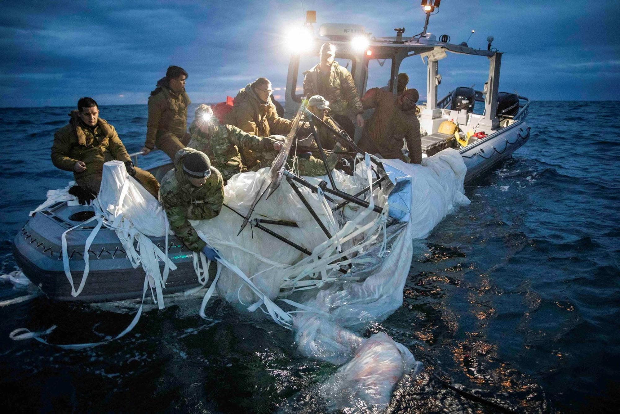 FILE PHOTO: Sailors assigned to Explosive Ordnance Disposal Group 2 recover a suspected Chinese high-altitude surveillance balloon that was downed by the United States over the weekend over U.S. territorial waters off the coast of Myrtle Beach, South Carolina, U.S., February 5, 2023. U.S. Fleet Forces/U.S. Navy photo/Handout via REUTERS/File Photo