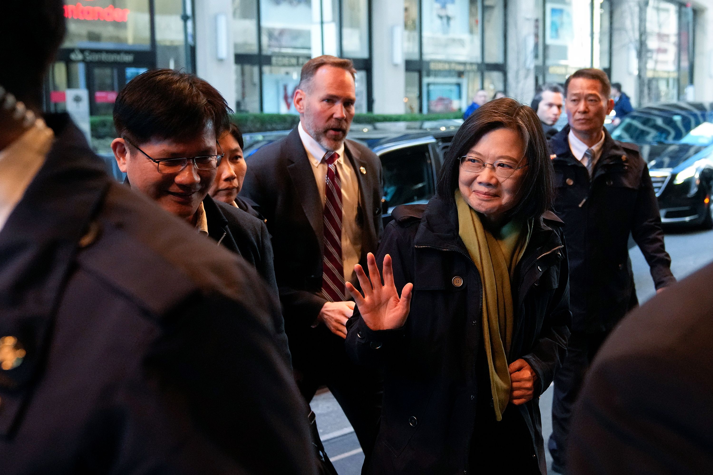 Taiwan's President Tsai Ing-wen waves as she arrives at a hotel in New York during a stopover on Thursday, March 30, 2023 a day before flying to Central America.