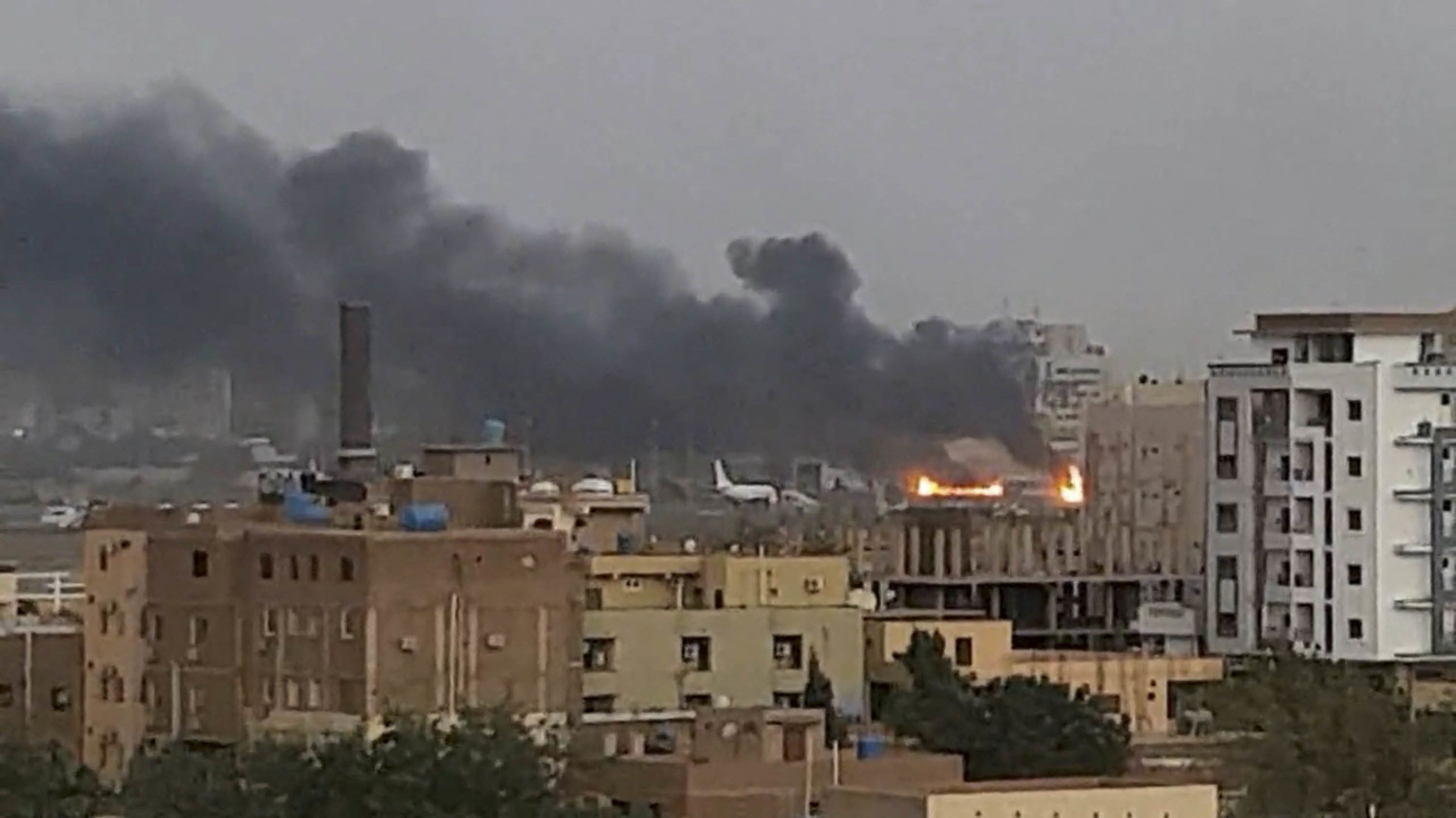 Smoke rises from the tarmac of Khartoum International Airport as a fire burns, in Khartoum, Sudan April 17, 2023 in this screen grab obtained from a social media video. Abdullah Abdel Moneim/via REUTERS  THIS IMAGE HAS BEEN SUPPLIED BY A THIRD PARTY. MANDATORY CREDIT. NO RESALES. NO ARCHIVES.
